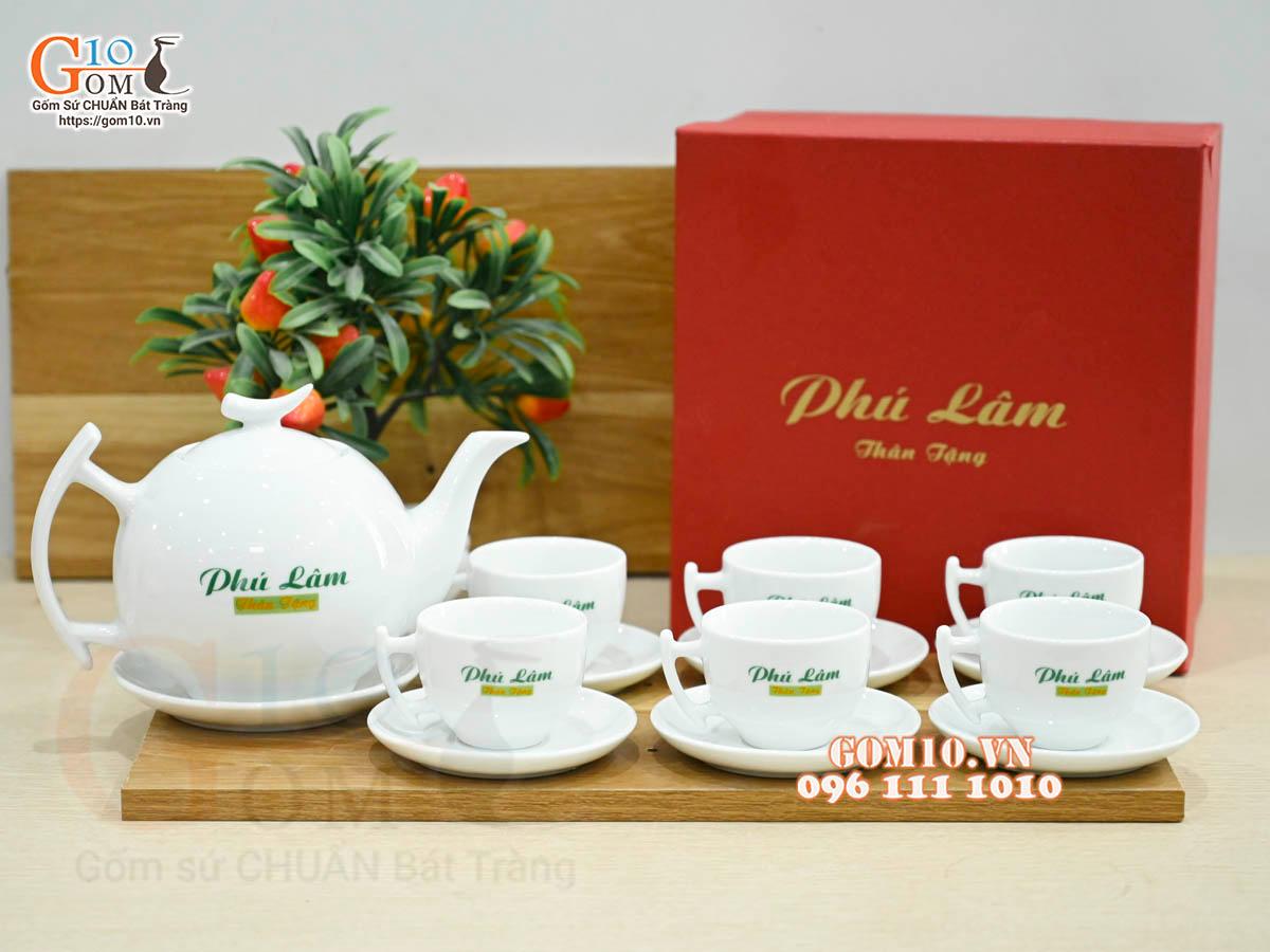 Bộ ấm chén dáng bưởi cành men trắng in logo VTV, 600ml Bộ ấm chén dáng bưởi cành men trắng in logo VTV, 600ml