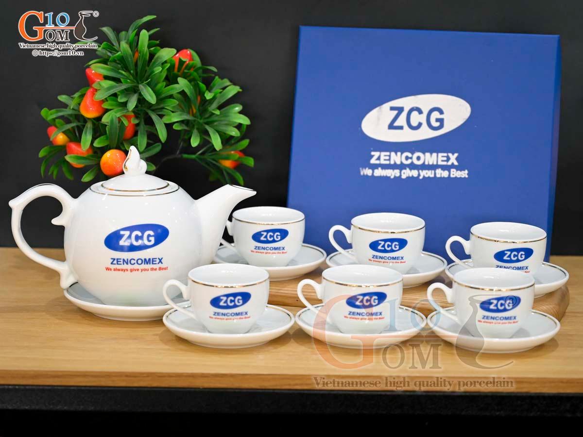 Bộ ấm chén dáng chóp lửa men trắng kẻ chỉ vàng kim, in logo VTV, 500ml Bộ ấm chén dáng chóp lửa men trắng kẻ chỉ vàng kim, in logo VTV, 500ml